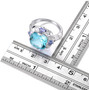 sky blue topaz tanzanite and white zircon statement ring in rhodium over sterling silver shown for size comparison