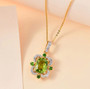 peridot chrome diopside and zircon halo pendant necklace in 18k yellow gold over sterling silver shown in a lifestyle photo