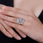 aquamarine morganite tanzanite and zircon cluster ring in 18k yellow gold over sterling silver worn on a hand