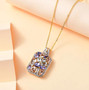 aquamarine morganite tanzanite and zircon cluster pendant necklace in 18k yellow gold over sterling silver shown in a lifestyle photo