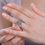 black and white diamond cluster rhodium over sterling silver ring on hand