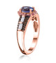 side view of tanzanite and pink sapphire white and brown zircon ring in 18k rose gold over sterling silver