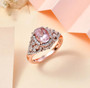 morganite and moissanite ring in rhodium and 18k rose gold over sterling silver shown in a lifestyle photo