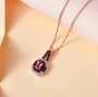 mahenge pink spinel brown and white zircon pendant necklace in 18k rose gold and black rhodium over sterling silver shown in a lifestyle photo