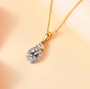 aquamarine and zircon halo pendant necklace in 18k yellow gold over sterling silver shown in a lifestyle photo
