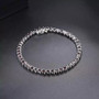 natural black garnet tennis bracelet in rhodium over sterling silver shown in a lifestyle photo