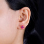 amethyst and pink enamel flower earrings in 18k yellow gold over sterling silver worn on the ear