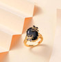 black spinel and champagne diamond butterfly ring in 18k yellow gold over sterling silver shown in a lifestyle photo