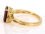 side view of garnet and red diamond solitaire ring in 18k yellow gold over sterling silver