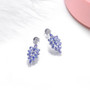 full view of tanzanite and white zircon dangle earrings in rhodium over sterling silver