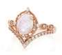 front view of rainbow moonstone and zircon solitaire ring in 18k rose gold over sterling silver