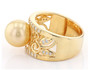 side view of golden south sea pearl and moissanite solitaire band ring in 18k yellow gold over sterling silver