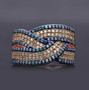 champagne and blue diamond crossover ring in 18k rose gold over sterling silver shown in a lifestyle photo