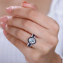 aquamarine sapphire and zircon ring in rhodium over sterling silver worn on a hand