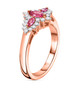 side view of mahenge pink spinel and white zircon trilogy halo ring in 18k rose gold over sterling silver