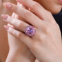 amethyst and pink sapphire halo ring in 18k rose gold over sterling silver worn on a hand
