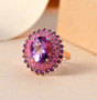 amethyst and pink sapphire halo ring in 18k rose gold over sterling silver shown in a lifestyle photo