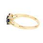 side view of blue sapphire and diamond trilogy ring in solid 14k yellow gold