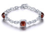 sugar loaf cut hessonite garnet and white zircon bracelet in rhodium over sterling silver