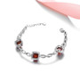 sugar loaf cut hessonite garnet and white zircon bracelet in rhodium over sterling silver