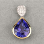 tanzanite and diamond pear pendant necklace in two-tone 18k yellow and white gold shown in a lifestyle photo