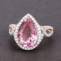 pink morganite and diamond pear halo ring in solid 14k rose gold shown in a lifestyle photo