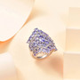 tanzanite and white zircon cluster ring in rhodium over sterling silver shown in a lifestyle photo