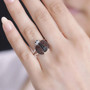 garnet black spinel and white zircon ladybug ring in rhodium over sterling silver worn on a hand
