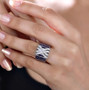 amethyst and white zircon cluster band ring in rhodium over sterling silver worn on a hand