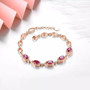 close up of rhodolite garnet and white zircon bracelet in 18k rose gold over sterling silver