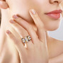 multi color sapphire and moissanite cluster ring in 18k yellow gold over sterling silver worn on a hand