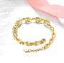 close up of sky blue topaz and white zircon bracelet in 18k yellow gold over sterling silver