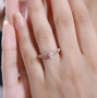 morganite and pink sapphire ring in 18k rose gold over sterling silver worn on a hand
