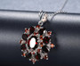 close up of black garnet pendant necklace in rhodium over sterling silver