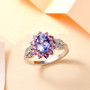 tanzanite pink sapphire and zircon ring in rhodium over sterling silver shown in a lifestyle photo