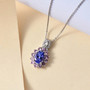 tanzanite pink sapphire and zircon pendant necklace in rhodium over sterling silver shown in a lifestyle photo