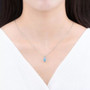 sky blue topaz oval pendant necklace in 14k white gold worn around the neck