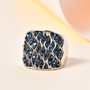 blue diamond cluster ring in rhodium over sterling silver shown in a lifestyle photo