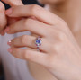 tanzanite pink tourmaline and zircon ring in rhodium over sterling silver worn on a hand