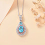 blue apatite pink sapphire and zircon pendant necklace in 18k rose gold and rhodium over sterling silver shown in a lifestyle photo