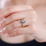 emerald brown and white zircon marquise halo ring in 18k yellow gold over sterling silver worn on a hand