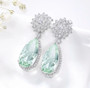 front view of amethyst or prasiolite halo dangle earrings in rhodium over sterling silver