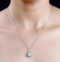 turquoise chrome diopside and zircon halo pendant necklace in rhodium over sterling silver worn around the neck