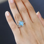turquoise fire opal and zircon two-tone ring in 18k yellow gold and rhodium over sterling silver worn on a hand