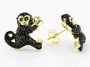 side view of black spinel and chrome diopside monkey earrings in 18k yellow gold over sterling silver
