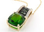 side view of chrome diopside and white zircon pendant necklace in black rhodium and 10k yellow gold