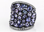 angled view of tanzanite and white zircon wide band cluster ring in black and white rhodium over sterling silver
