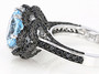 side view of sky blue topaz and black spinel ring in black and white rhodium over sterling silver