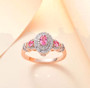 mahenge pink spinel and white zircon ring in 18k rose gold over sterling silver shown in a lifestyle photo