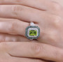 peridot tsavorite garnet and zircon double halo ring in rhodium over sterling silver worn on a hand